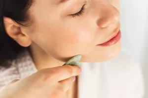 gua sha reduce face fat