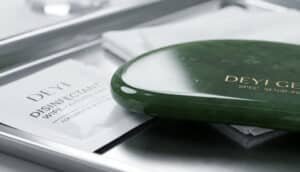 A close-up shot of a Gua Sha tool, featuring a perfectly polished and smooth surface.
